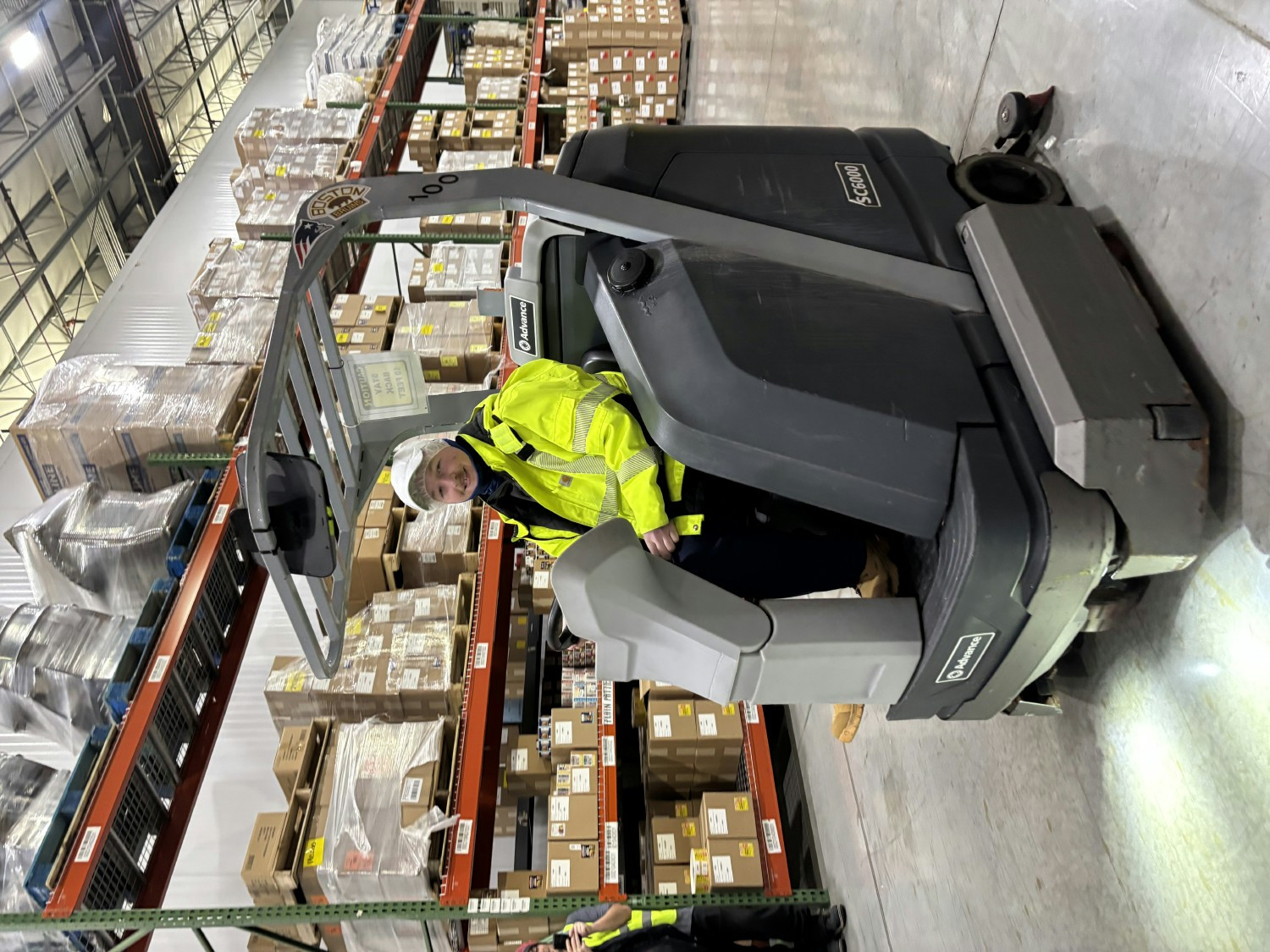 A member of our facilities team using the Zamboni machine to keep our building clean and ready for operations.