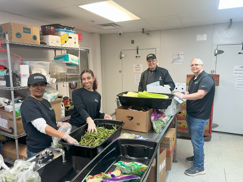 We love giving back to our community! Here are some team members sorting product at a local food pantry.