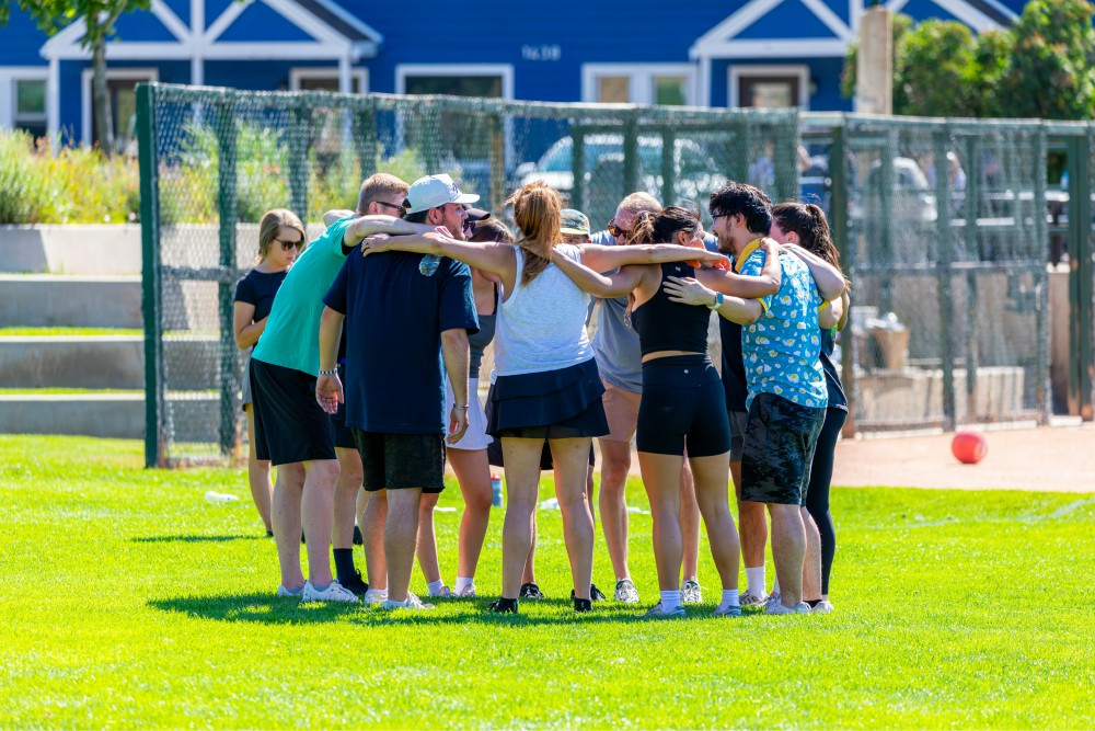 Outdoor activity huddle in Q3.