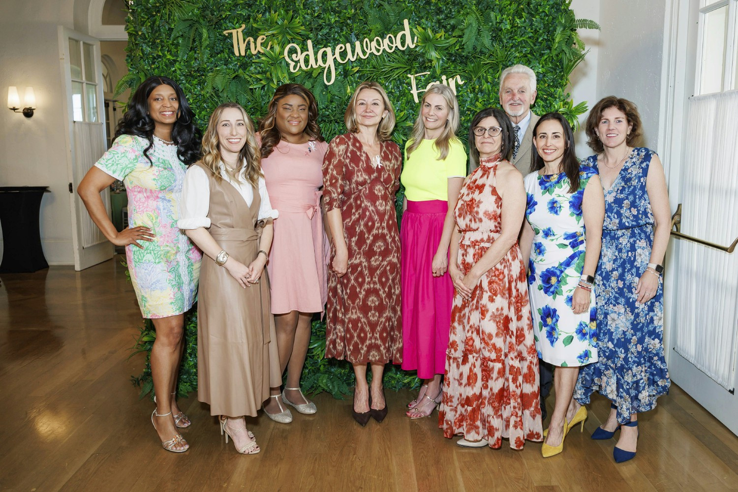 Members of the Board of Directors and CEO come together to celebrate at the annual Edgewood Fair.