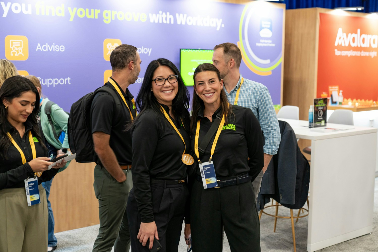 Two employees excited to be at the Workday Rising conference. 