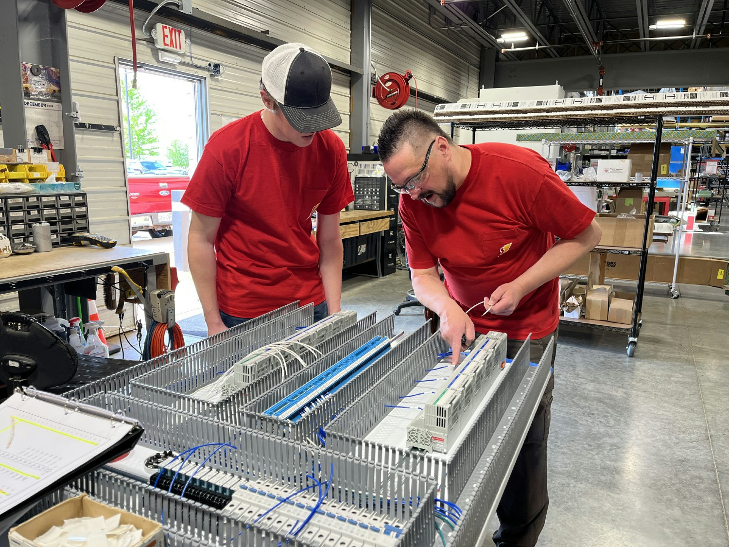 Training a new employee in the panel shop.