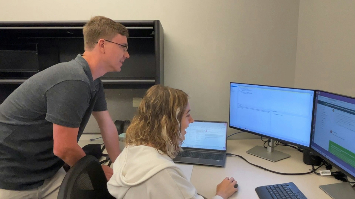 Software team employees working together on a project. 