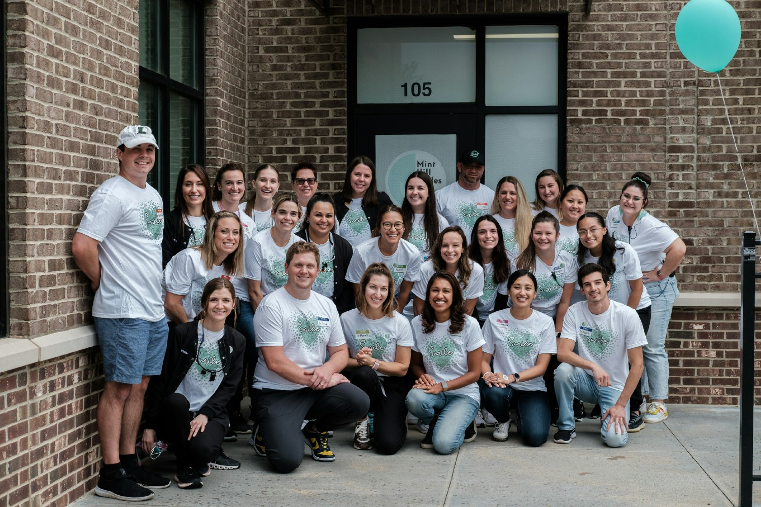 Our team (and loved ones) volunteering at our Smiles From The Heart (Free Dentistry Event) we host every year!