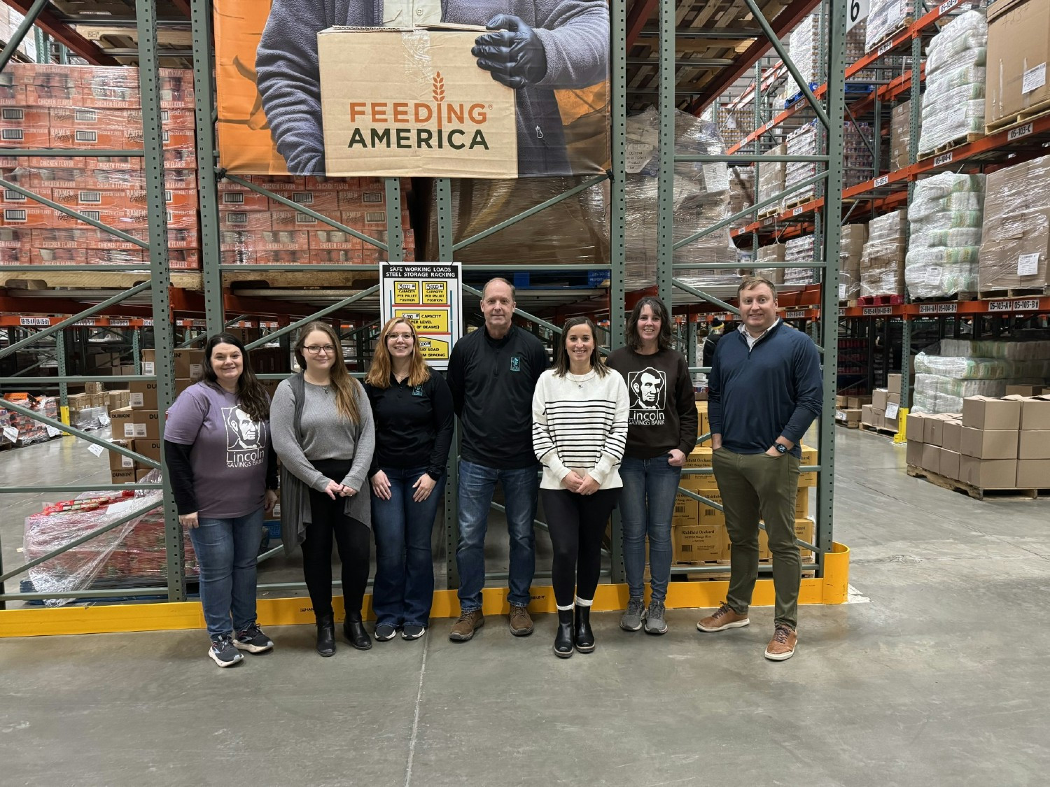 SB employees taking a photo after volunteering at the Northeast Iowa Food Bank. 