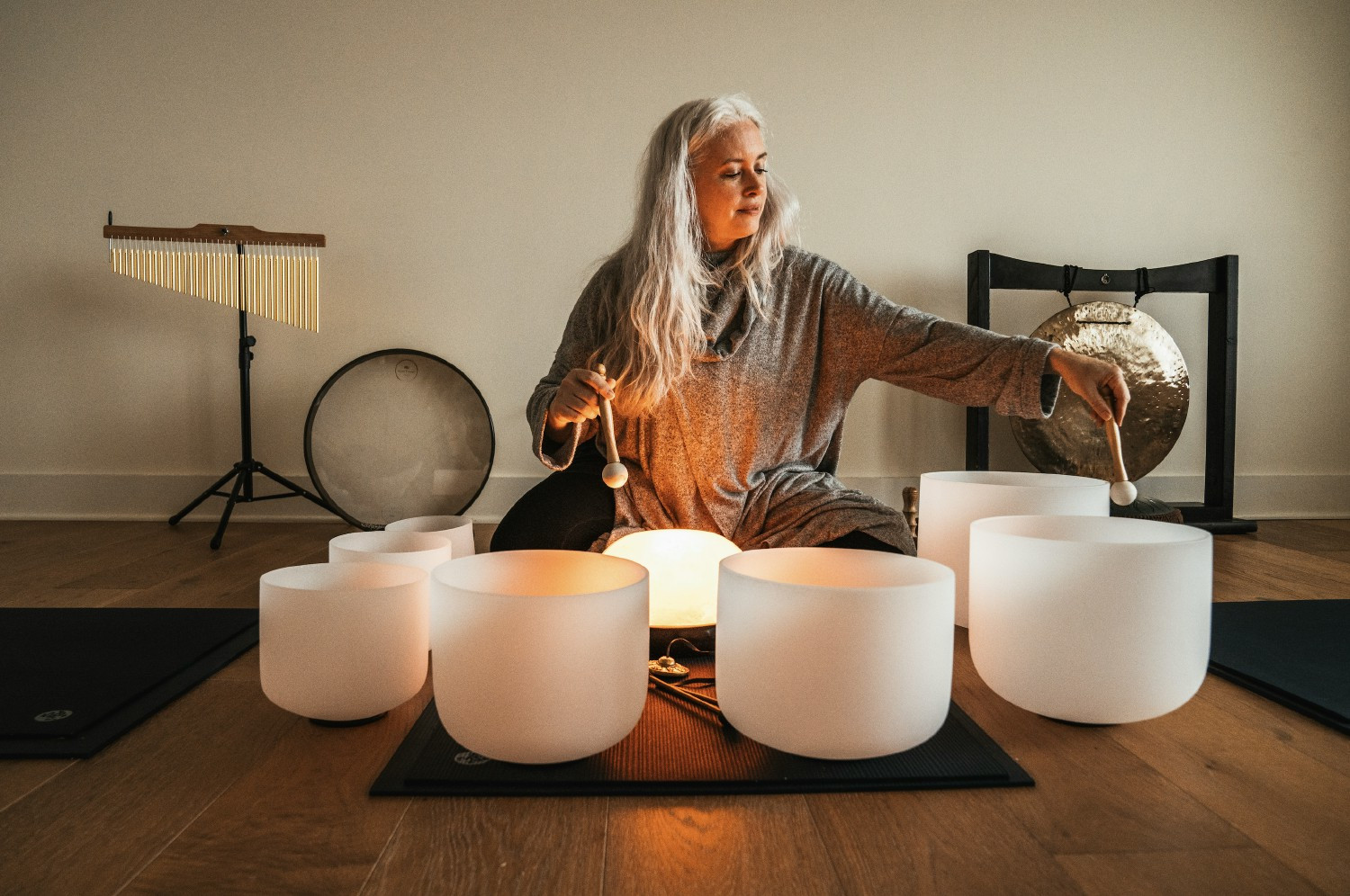 Suzanne, our master Wellness Instructor, guides a peaceful sound bath in our tranquil yoga studio.