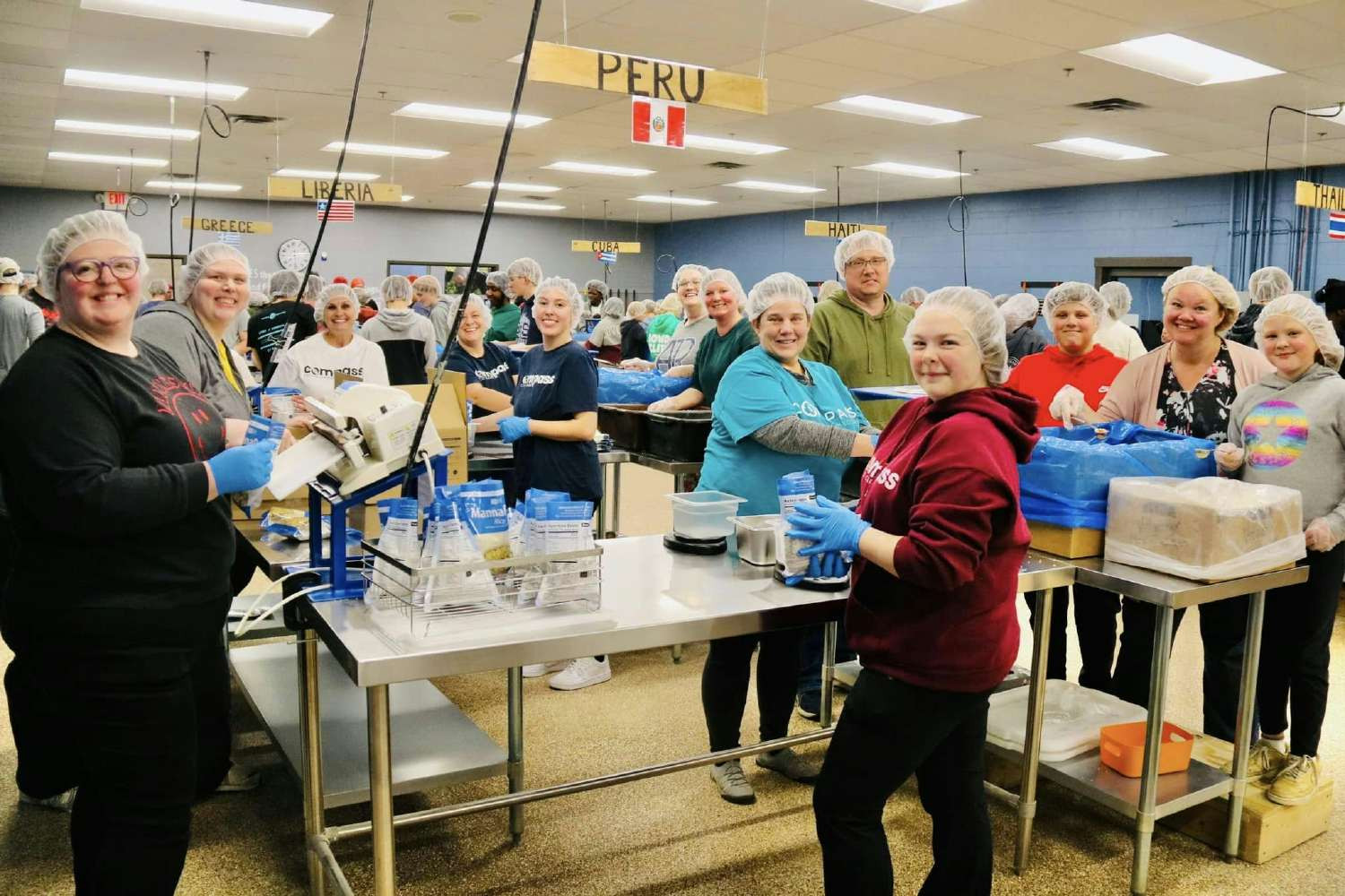 Employees volunteering at Feed My Starving Children