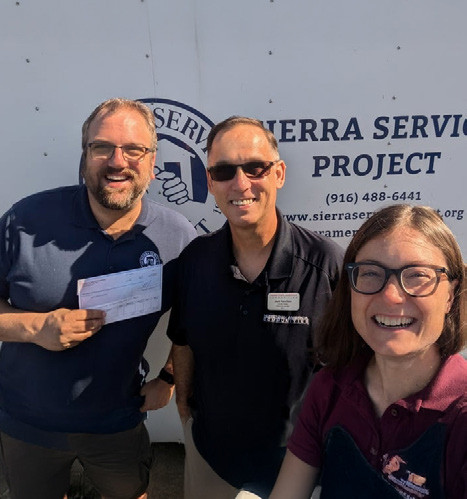 A California based manager presents a Hometown America Foundation check to a local charity.