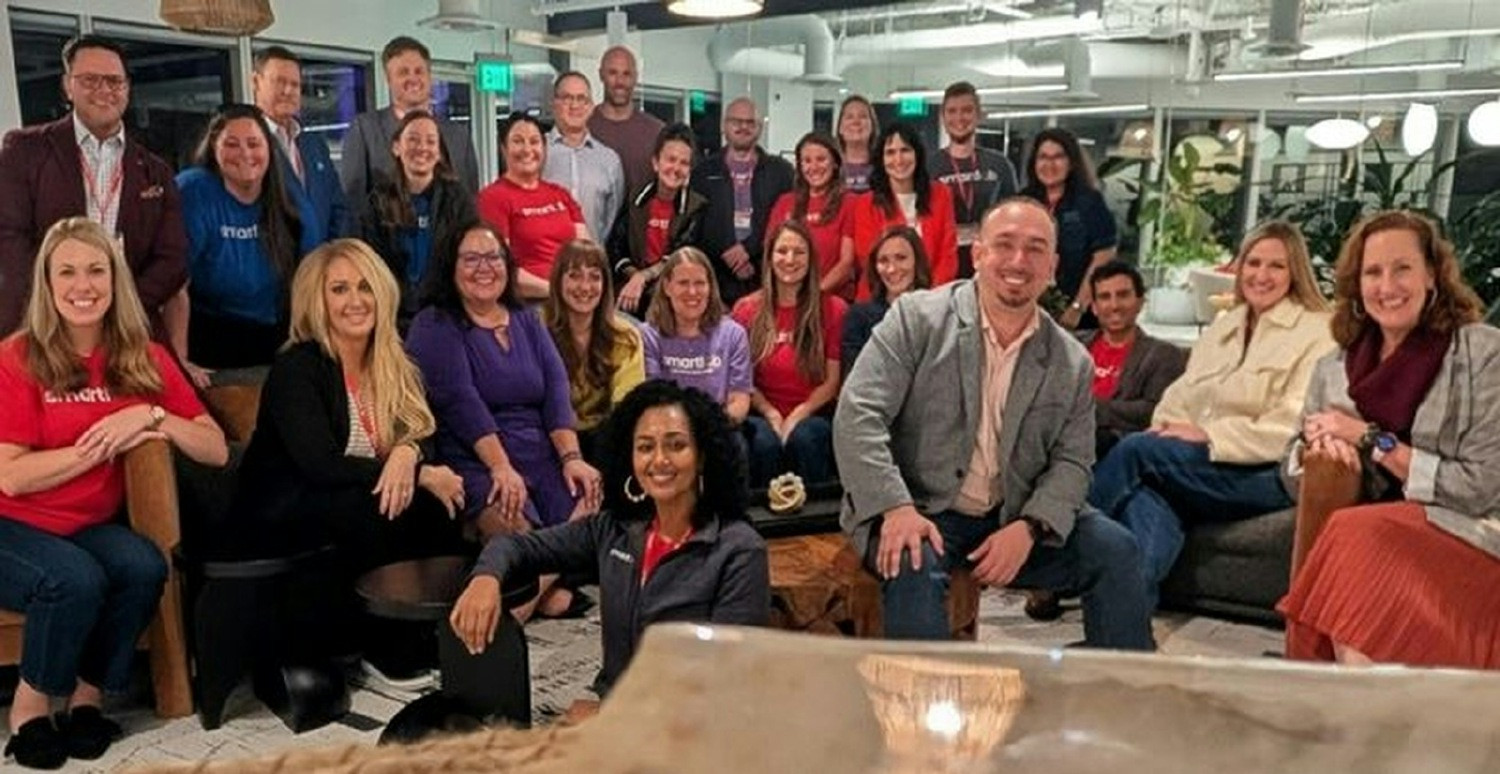 SmartLab employees gather during an in-person meeting and team building.