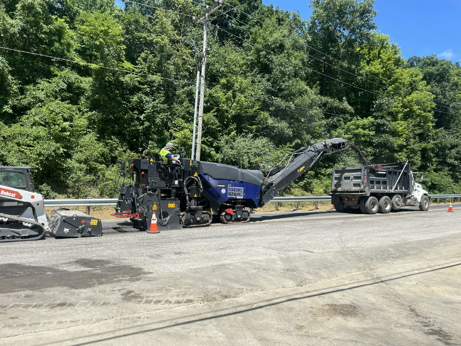 Milling on Africa Road for a widening and resurfacing project.