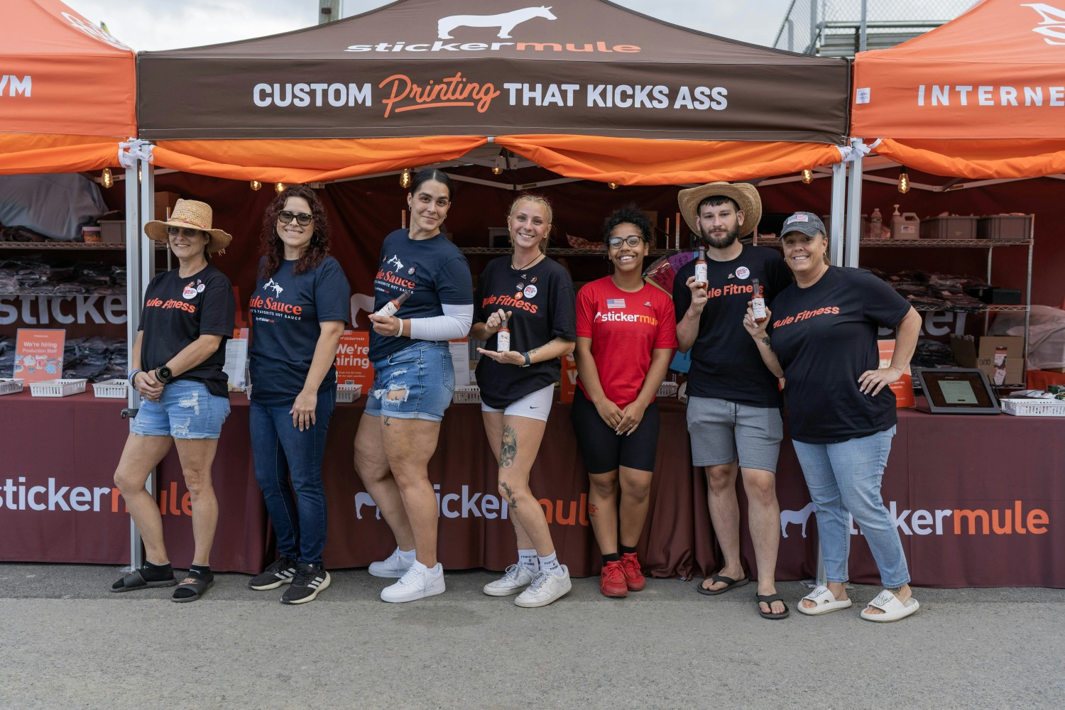 Sticker Mule employees representing Mule Fitness and Mule Sauce at a local hiring event.