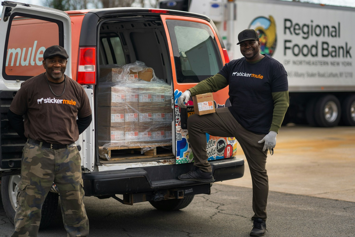 Team members delivering donations to the Regional Food Bank.