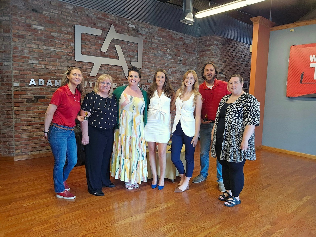 Team members from our Peoria, Illinois market celebrating their in-office sales competition win.
