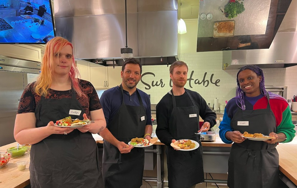 Freedos participating in a cooking class during a team offsite in Chicago. 