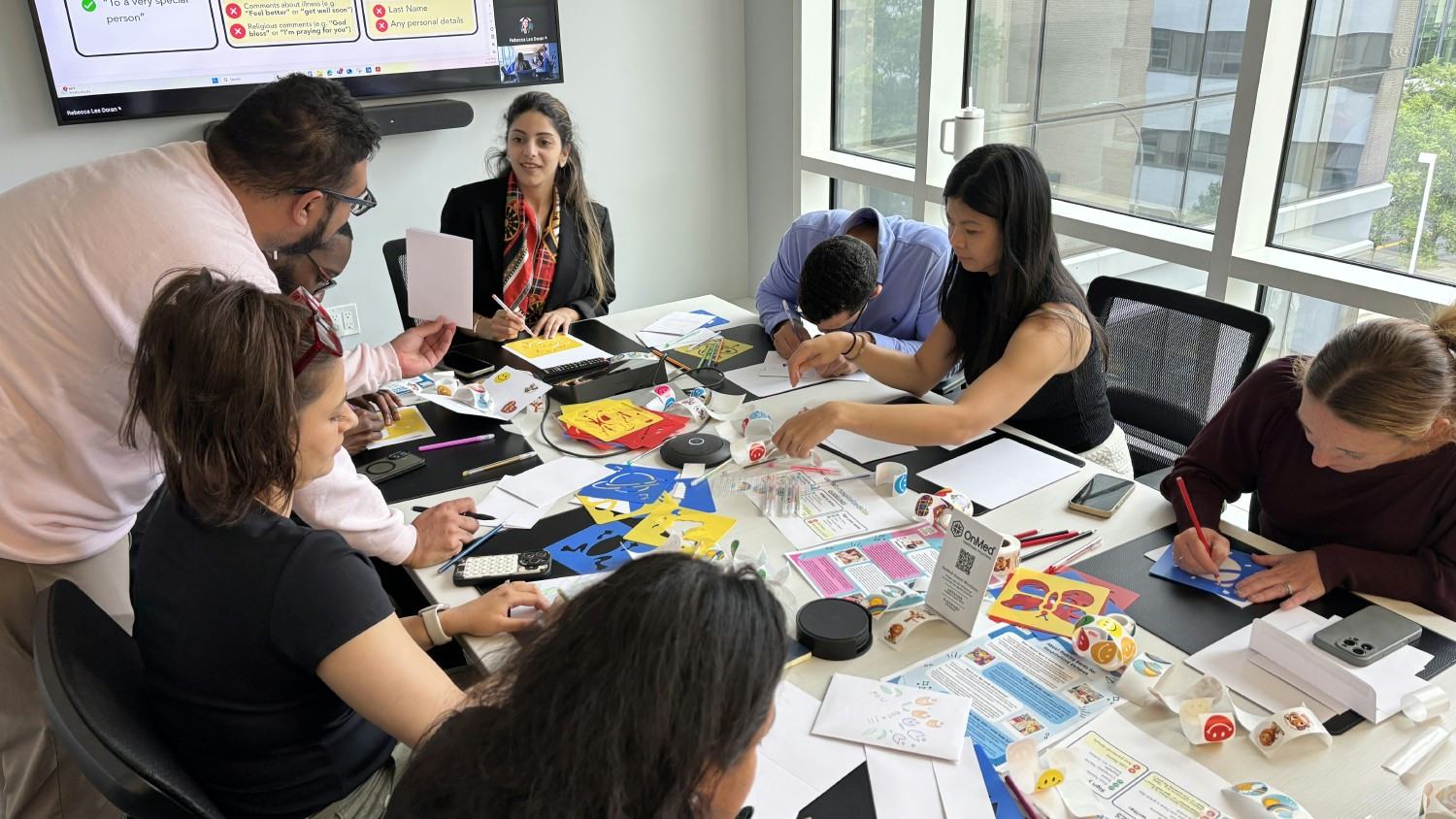 The OnMed team volunteered their time to create heartfelt, handmade cards for Cards for Hospitalized Kids. 