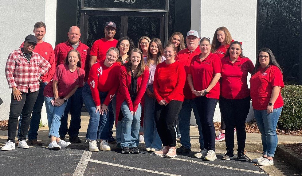 On National Wear Red Day, employees join others worldwide in wearing red to raise awareness about heart disease in women