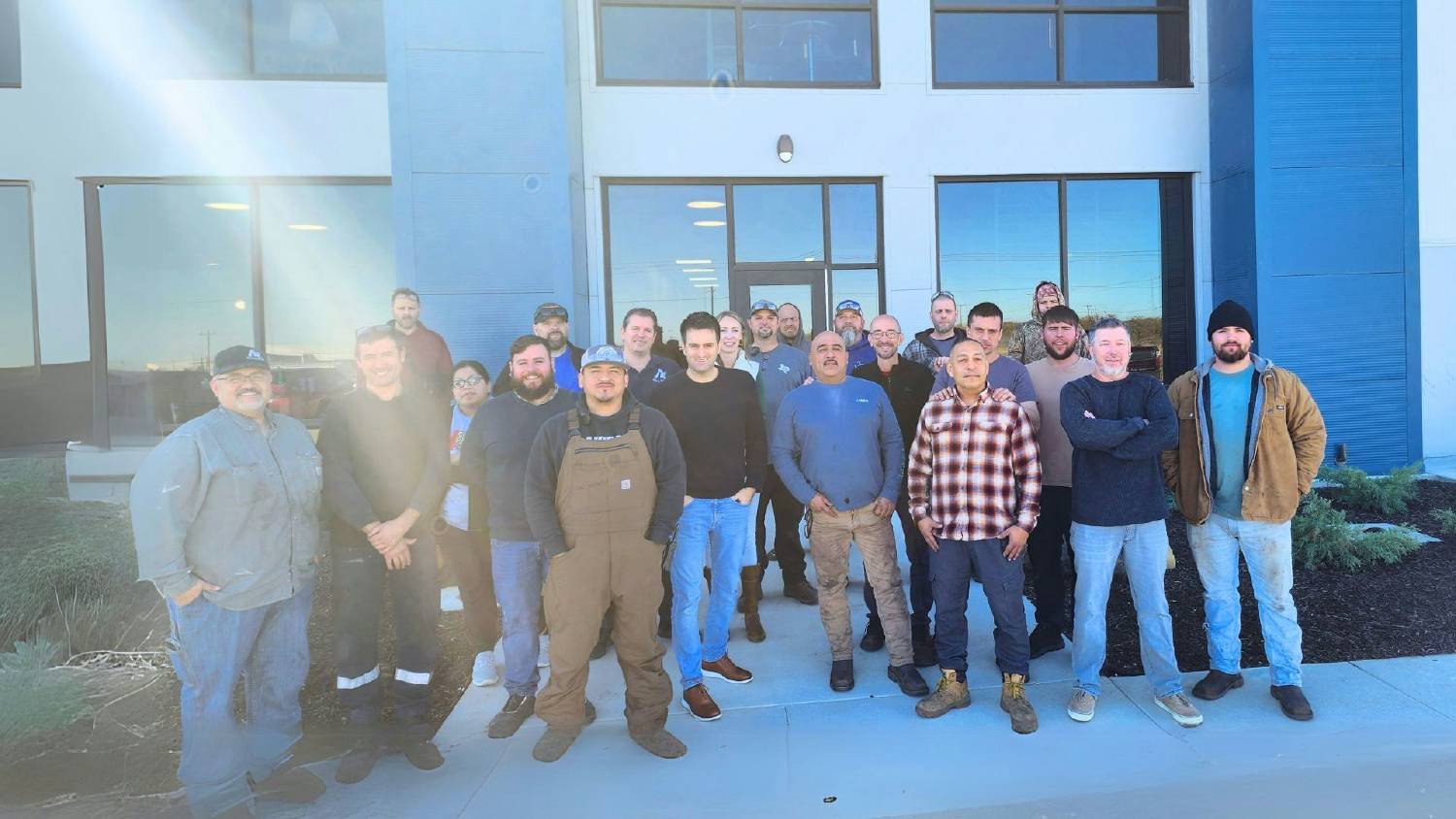 Meet the powerhouse behind our McGregor manufacturing facility! Our team stands tall in front of our new facility.