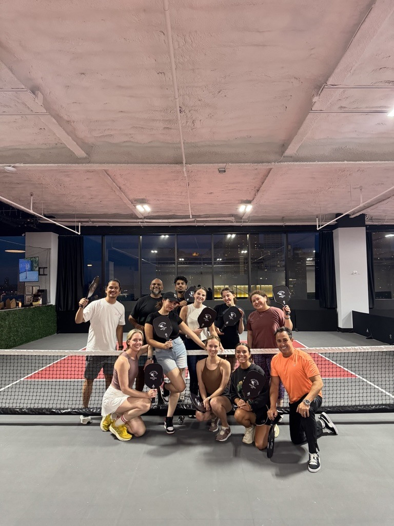 Our team loves a friendly game of pickleball!