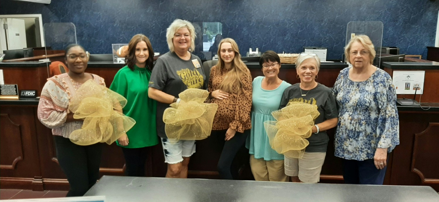 Team members supporting local childhood cancer organizations who support affected families in our communities.