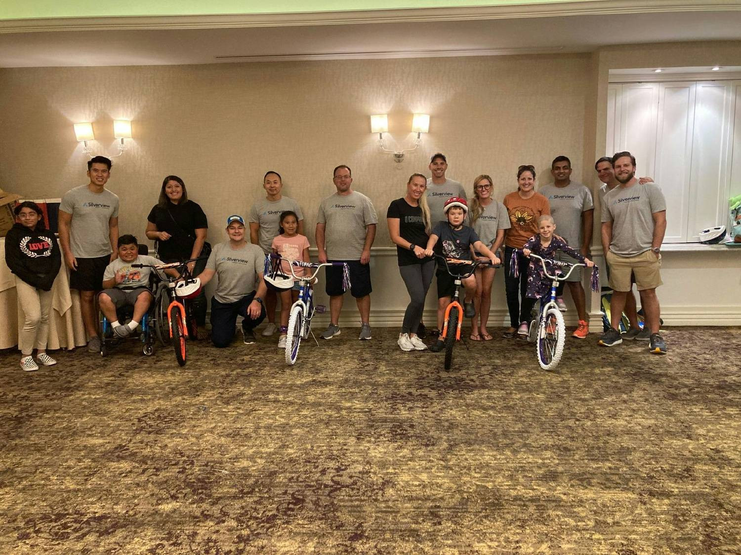 Silverview combined team building and volunteer work, building bikes for youth charities. 