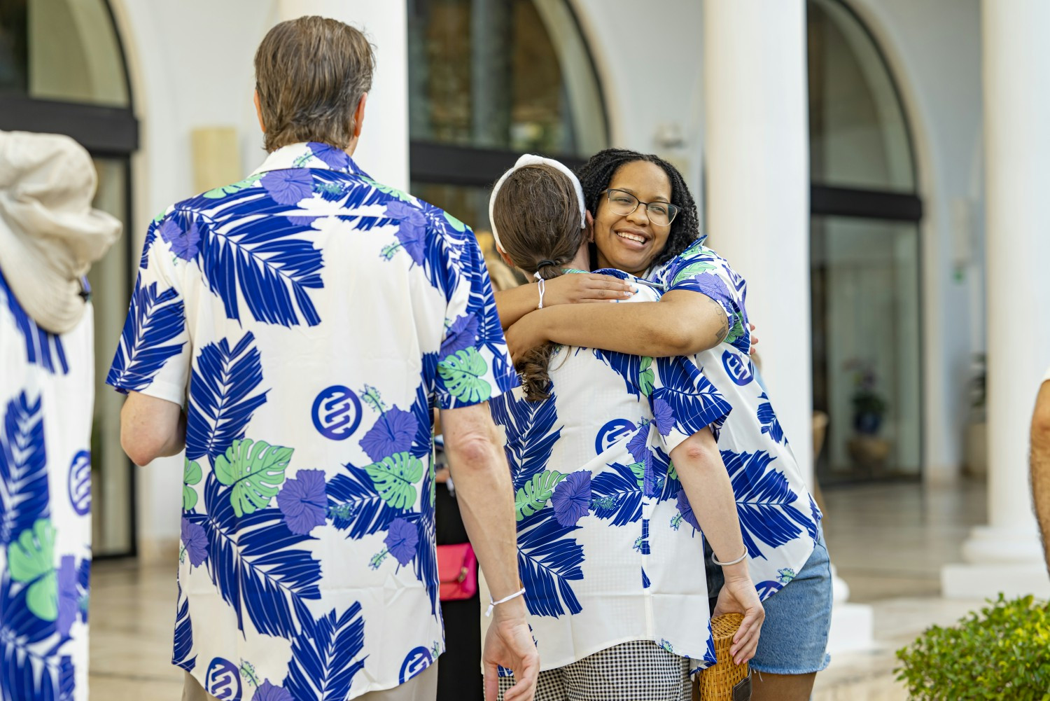 Impiricus staff embracing at celebratory event in Punta Cana