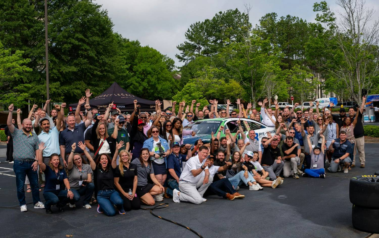 The Pye-Barker team during the reveal of a new NASCAR sponsorship paint scheme featuring all 8,000 team names.
