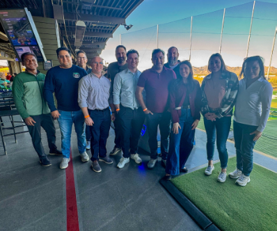 Happy hour at Topgolf, combining a fun team-building experience with an opportunity to connect with our partners