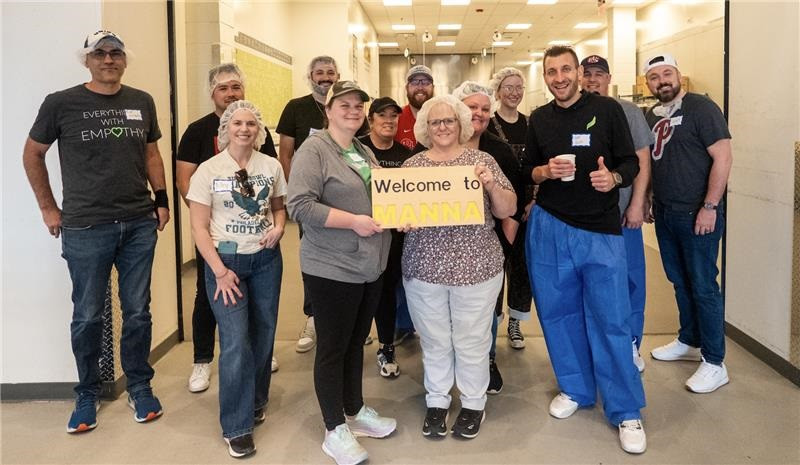 Jefferson Avenue team and partners preparing meals at one of our monthly community volunteer events.