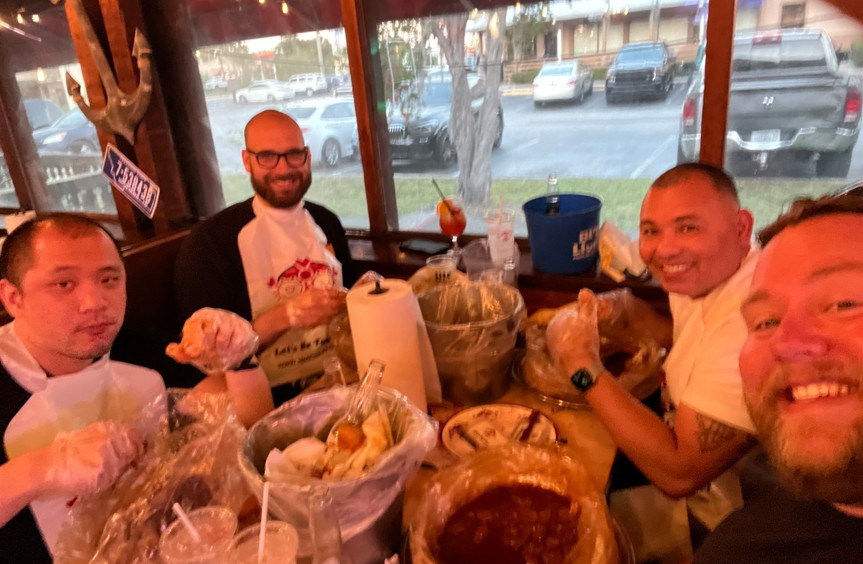 Some of the Nighthawk Cyber crew grabbing a bite while working at an off-site.