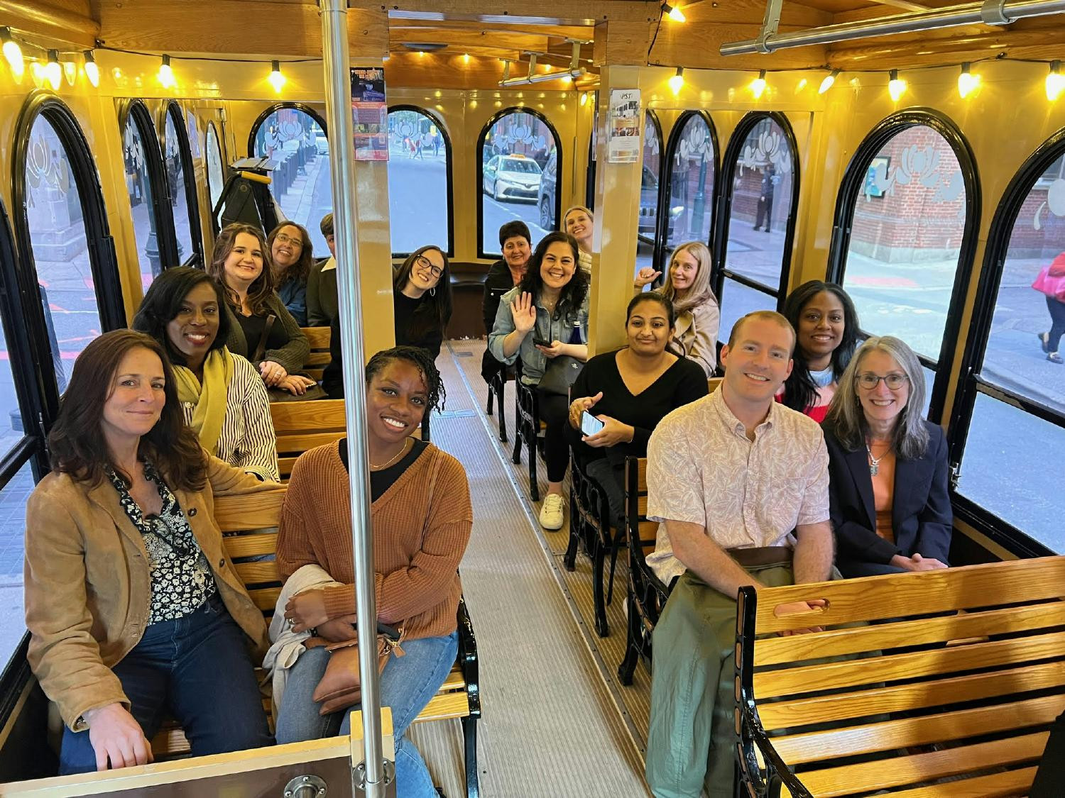 ABS staff enjoying a trolley ride through the city on the way to a staff retreat dinner event.