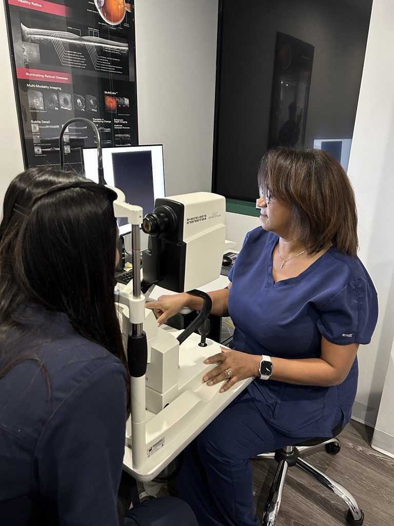 Rosalie, our experience Ophthalmic Medical Technologist is taking a comprehensive diagnostic scan of our patient's eyes.