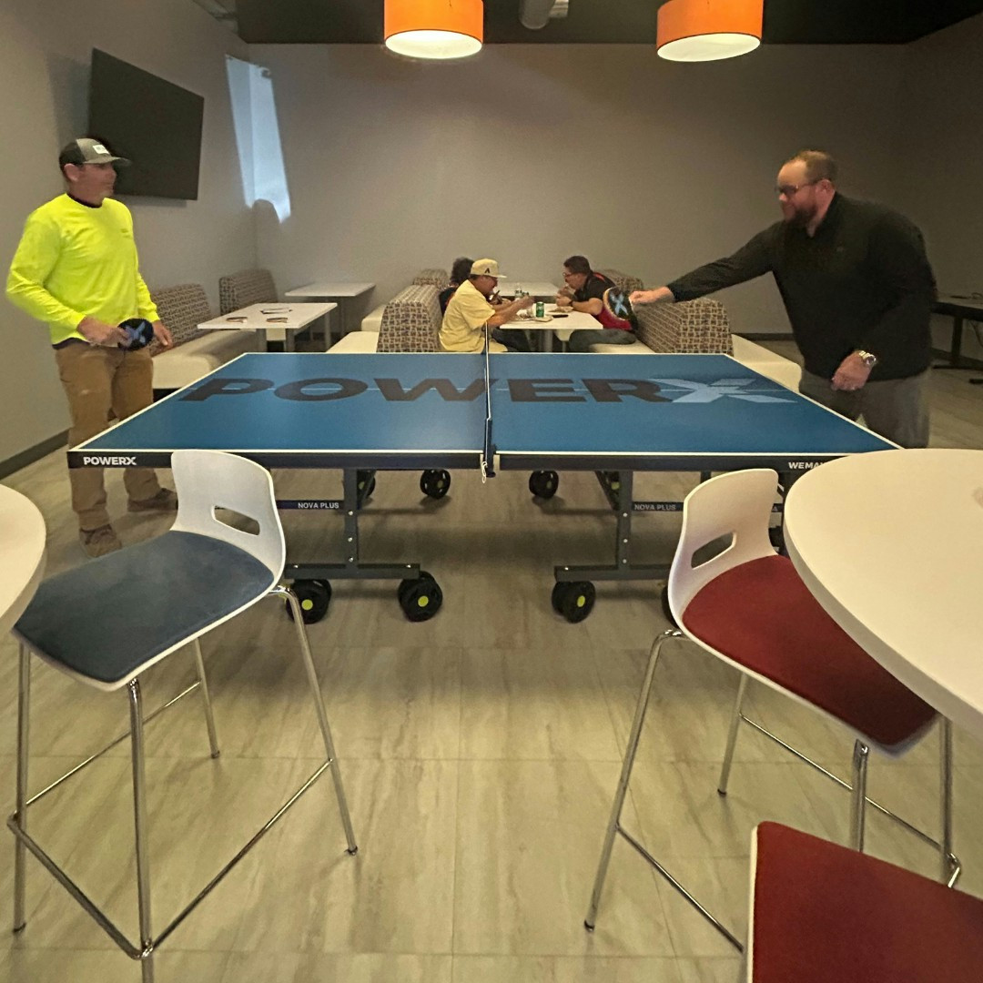 Our Arizona team playing ping pong during our recent cookout.