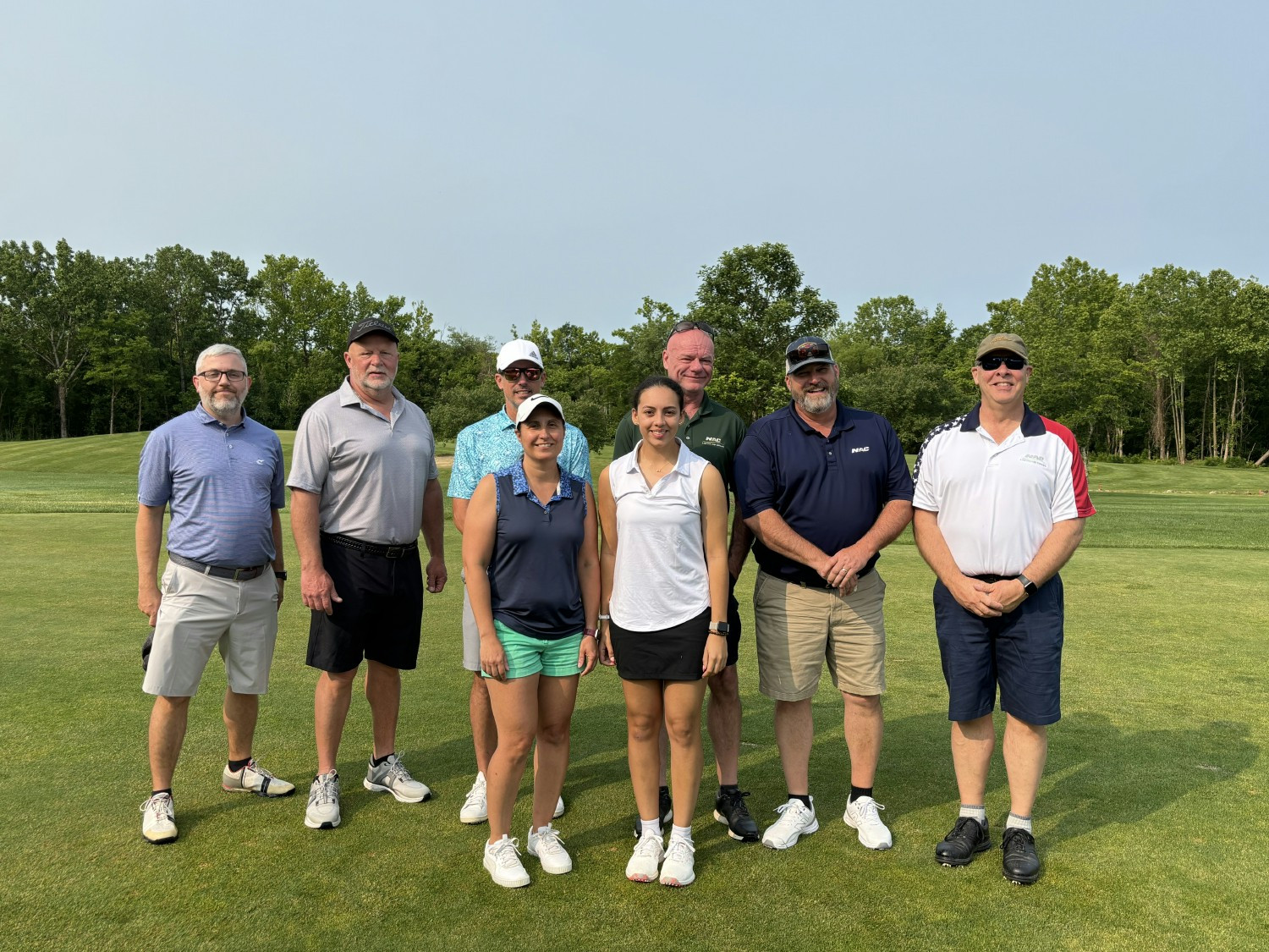 NAC executives playing golf for a charity tournament 