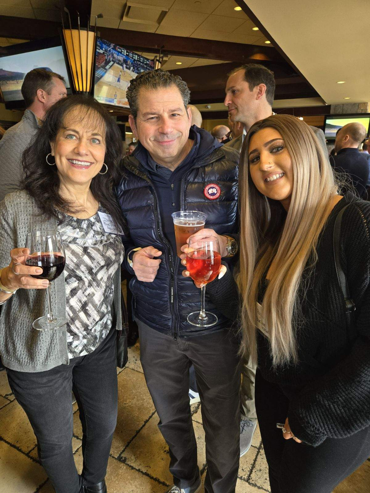 Building relationships at the Wintrust March Madness event. Staying connected in our community matters. 