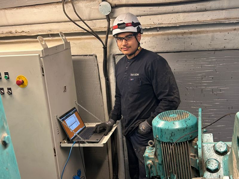Employee performing work in shop.