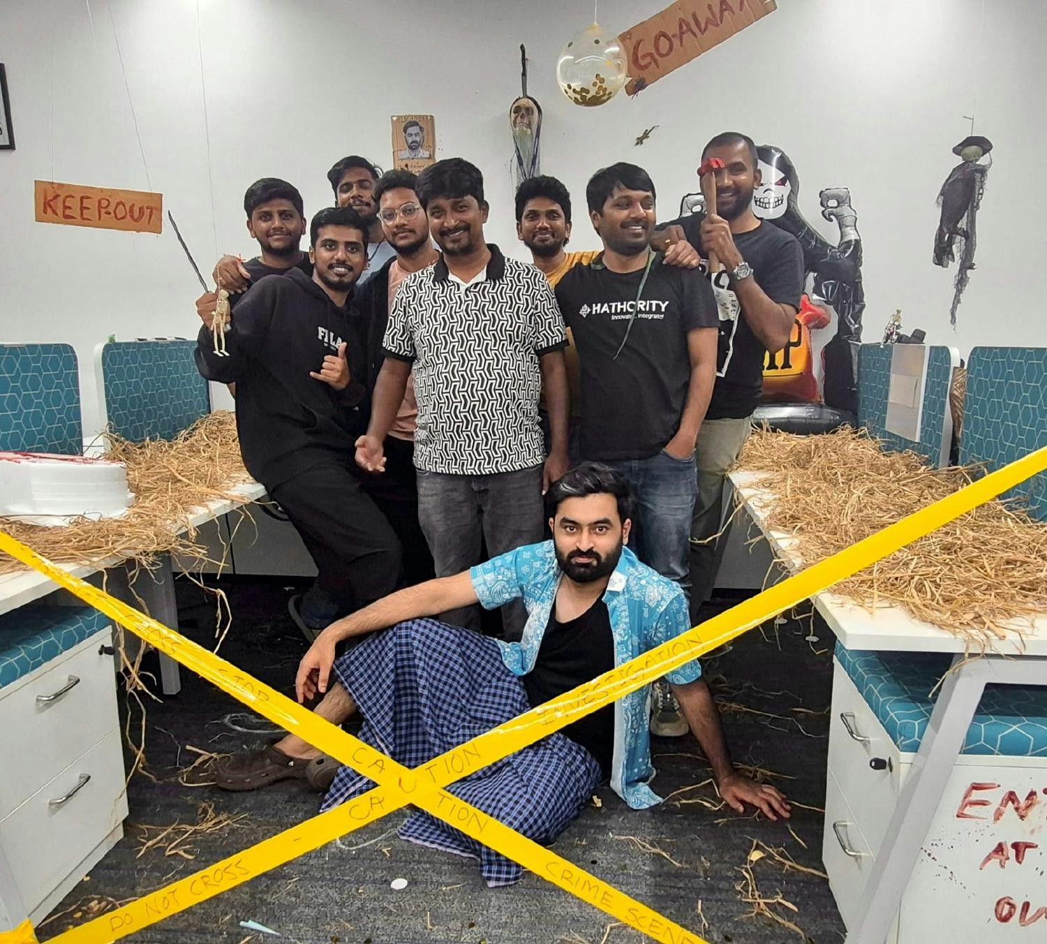 Employees transformed their workspace into a Halloween-themed bay with decorations and creative displays.