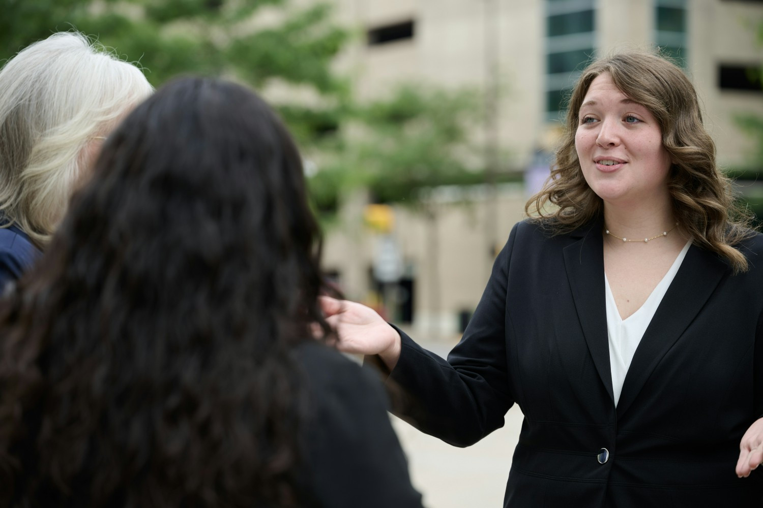 Hannah Zurbrick, Compliance and HR Manager, connecting with coworkers.