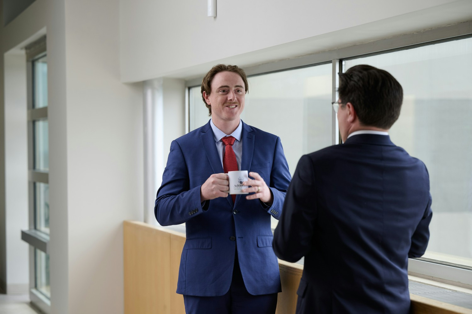 Nick Handlon, Senior Account Executive, and Nick Hankoff, Senior Sales Advisor, share ideas and brainstorm over coffee.