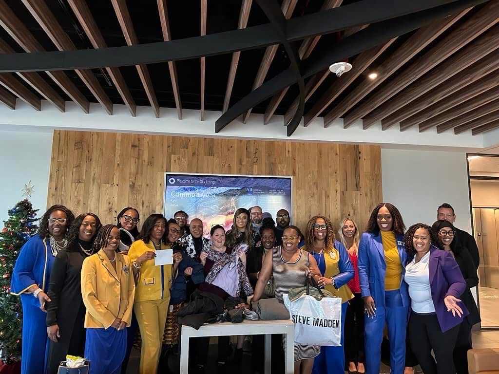 The entire ICHQ staff is celebrating the items we collected for a clothing and coat drive for a local organization.