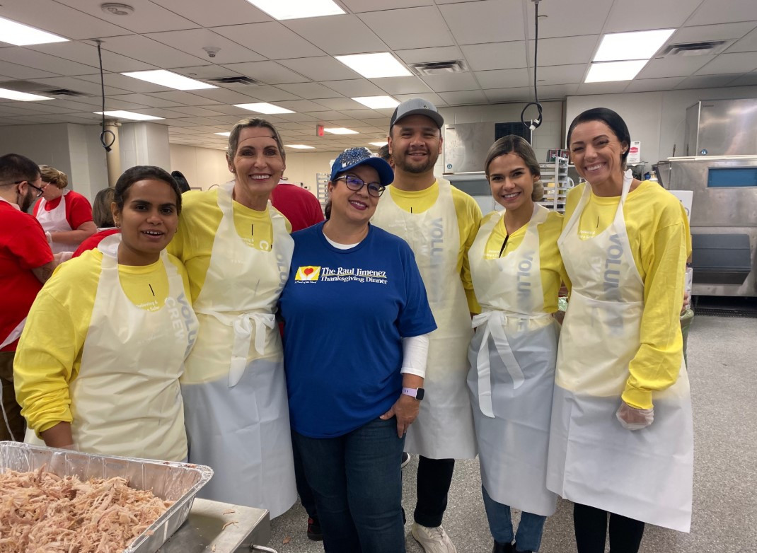 Employees volunteering time on Thanksgiving to serve flood. 