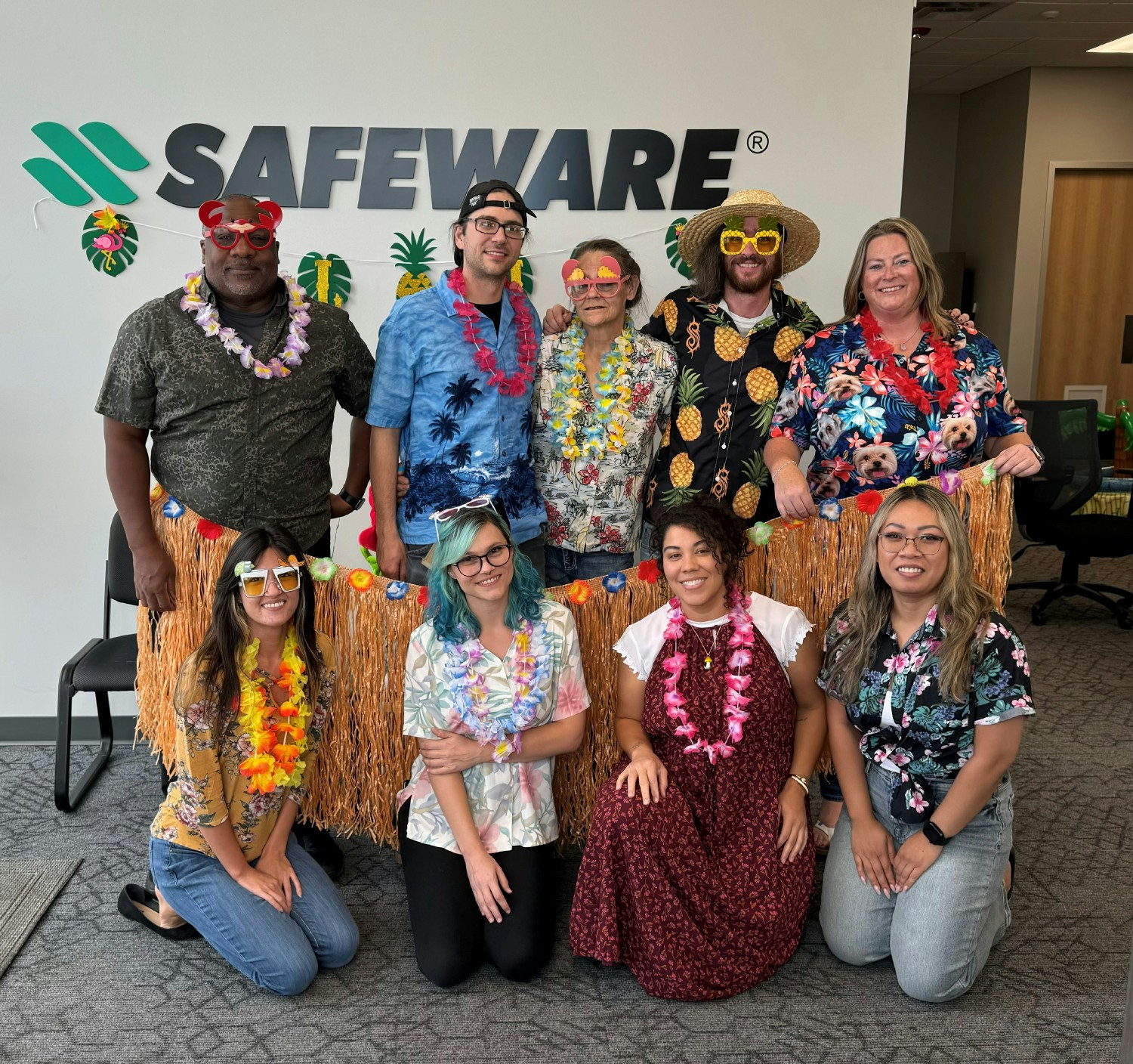Safeware’s Denver team celebrating a special Friday with a Hawaii-themed luau.