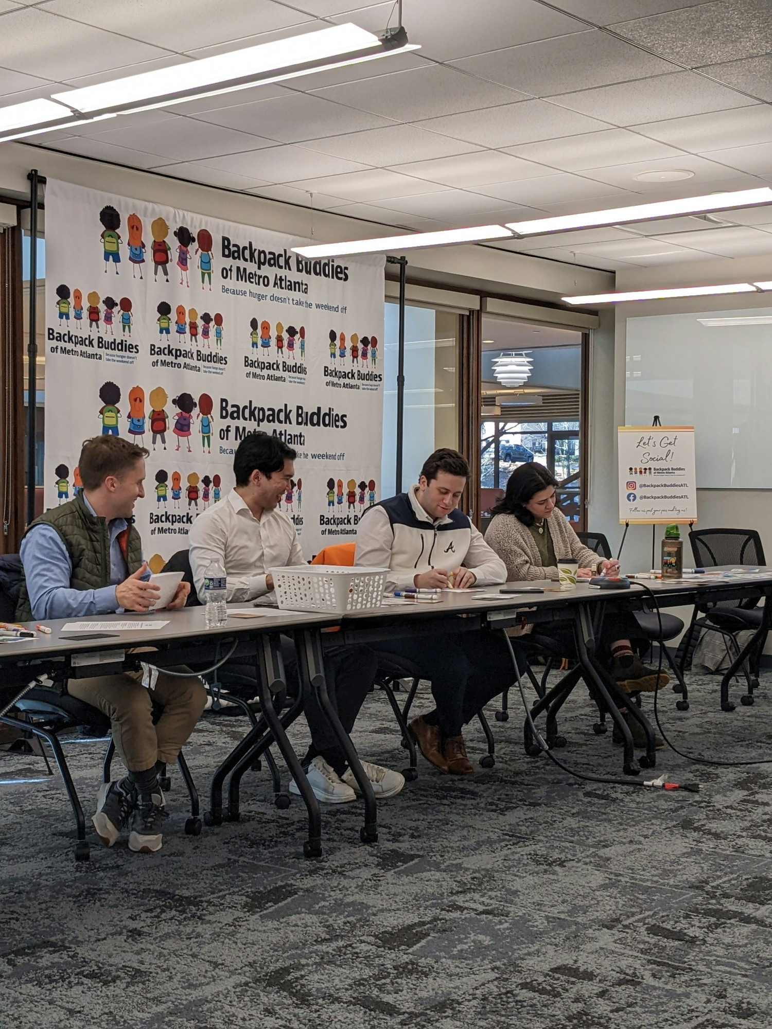 Managing Directors and new hires work together to help ATL at risk youth and worked together towards our goal.