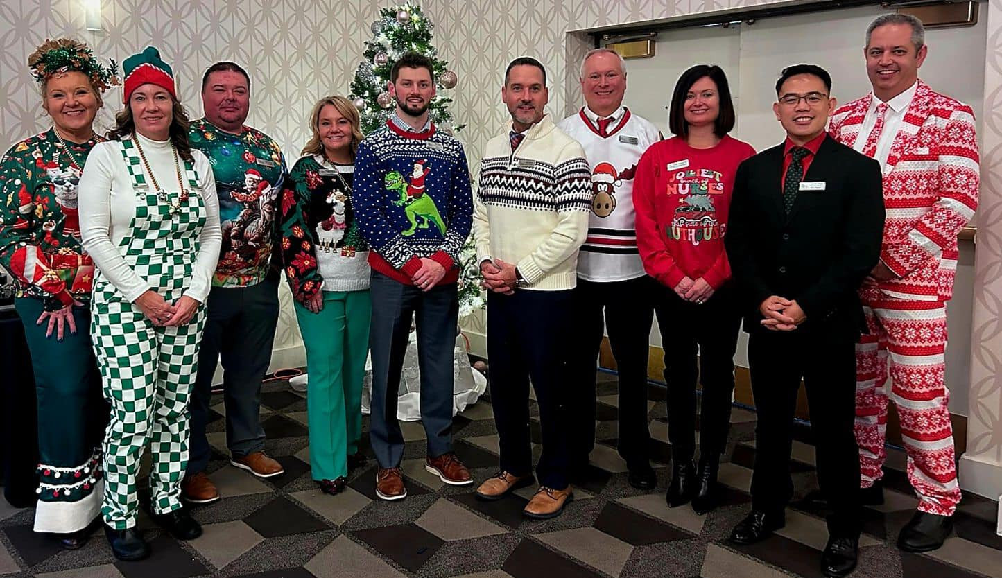 senior leadership team working hard and playing hard at Christmas