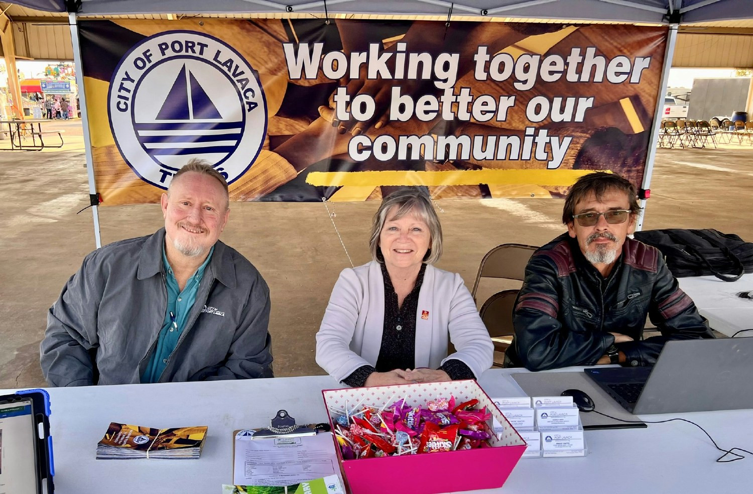 The City Manager and management staff members at an information booth at the County Fair.