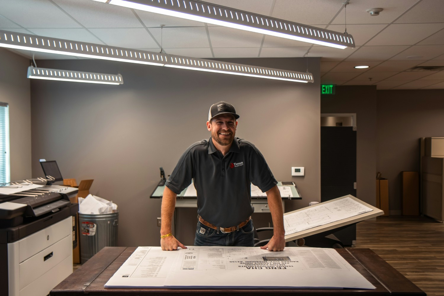 Project Manager reviewing electrical plans for a commercial construction project.