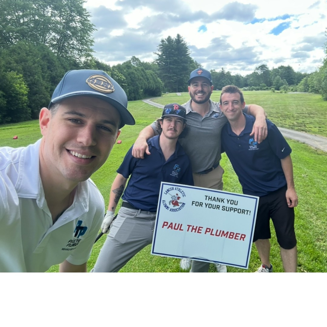 Small group of team members at a PTP sponsored golf event. 