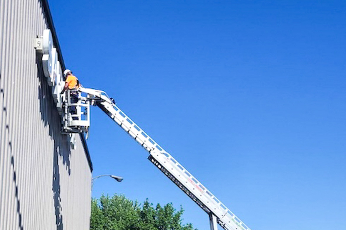 Installing a sign we made