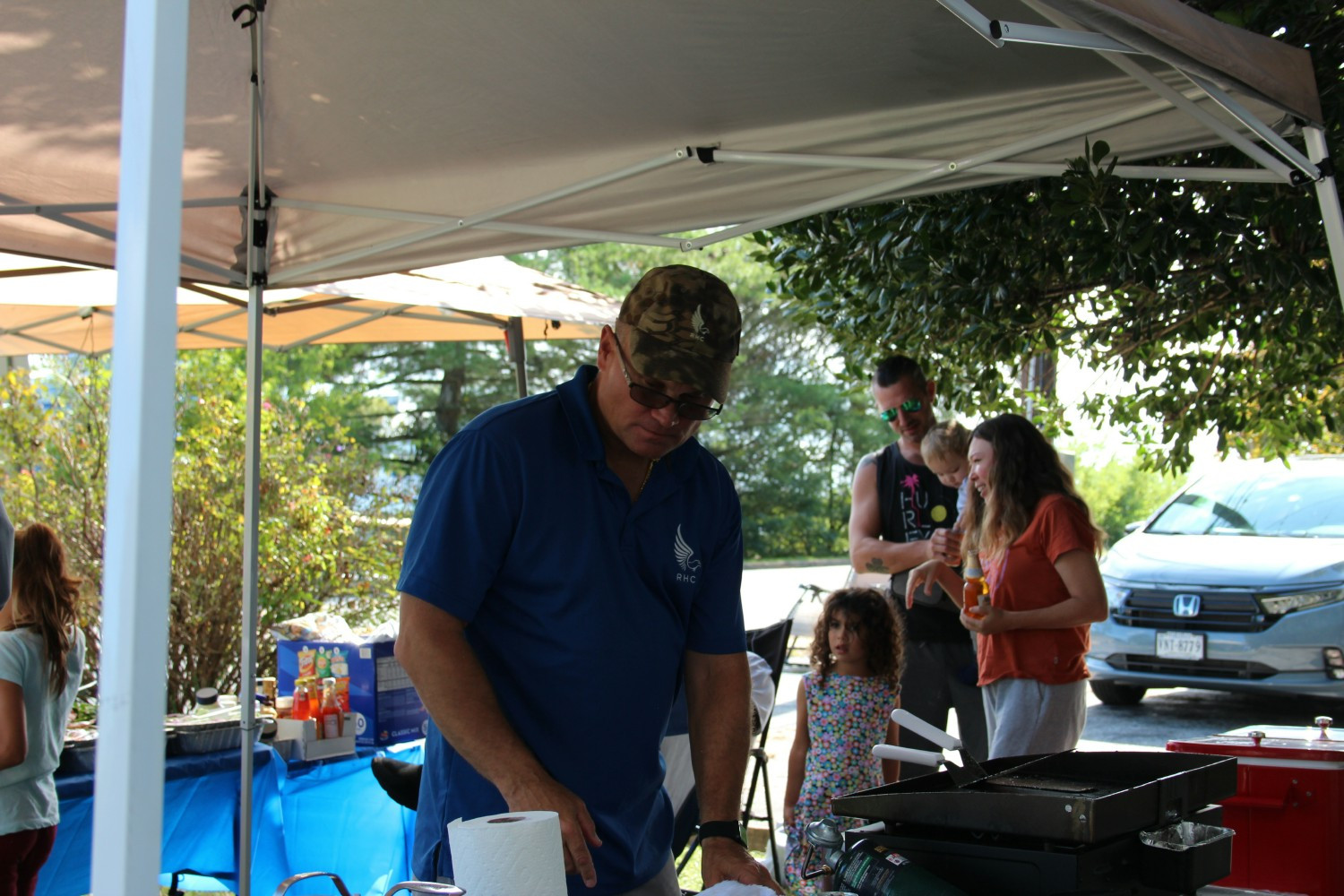 CEO/Chairman John Helm Jr. Providing Food to all staff members at a company appreciation gathering.
