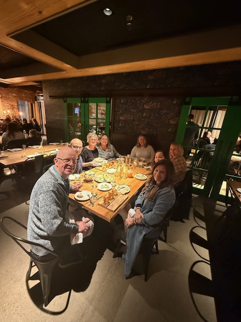 Our Executive Leadership Team having dinner after all day meetings