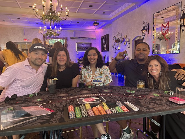 Mix of Leadership Team and staff at a team building casino night